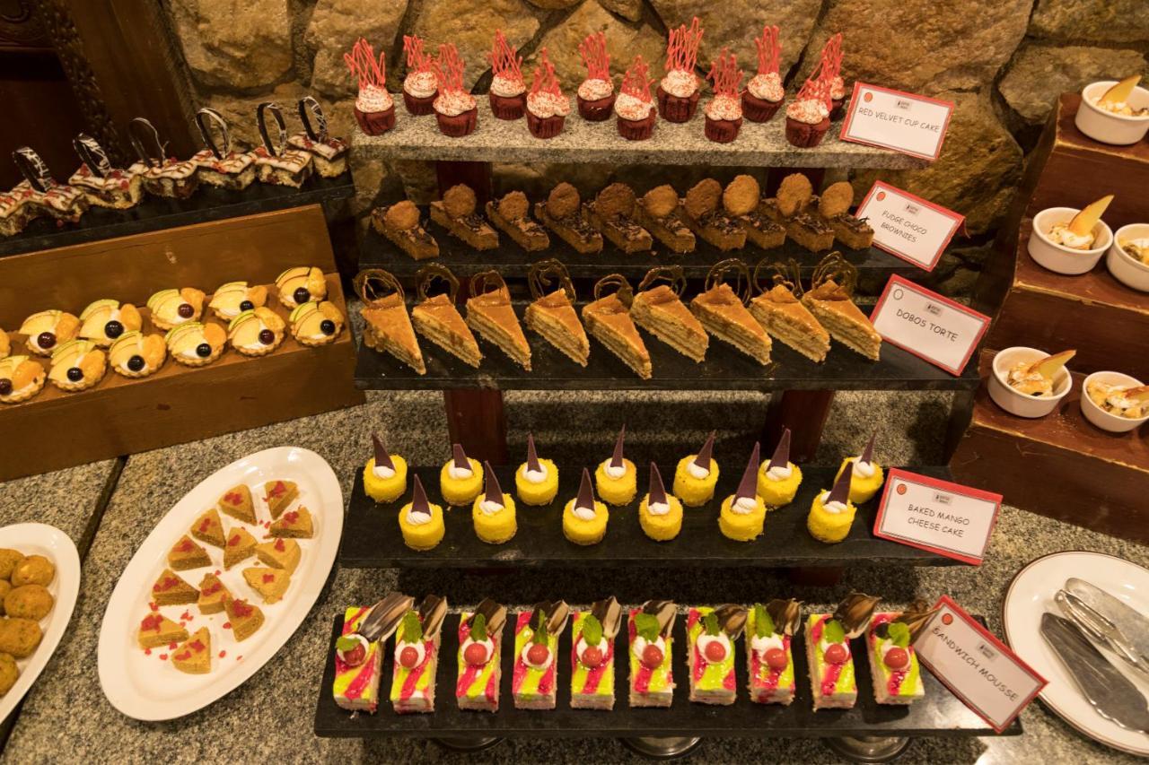 Heritage Мадурай Экстерьер фото A selection of desserts